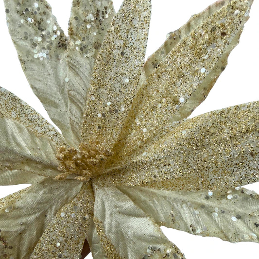Flor navideña dorada con glitter brillante – toque luminoso y festivo